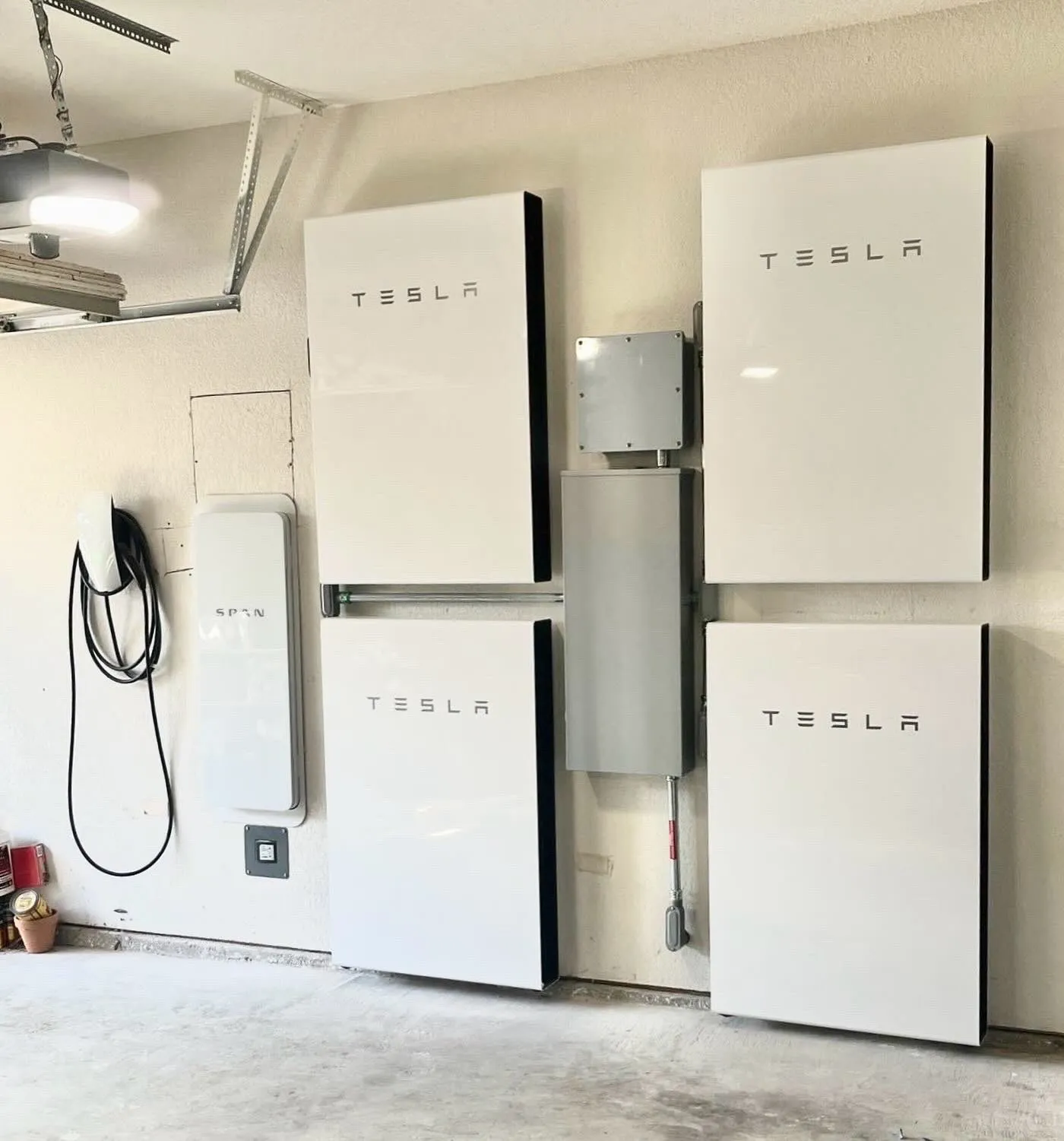 Tesla Powerwall, SPAN panel and EV charger installed in a Texas garage