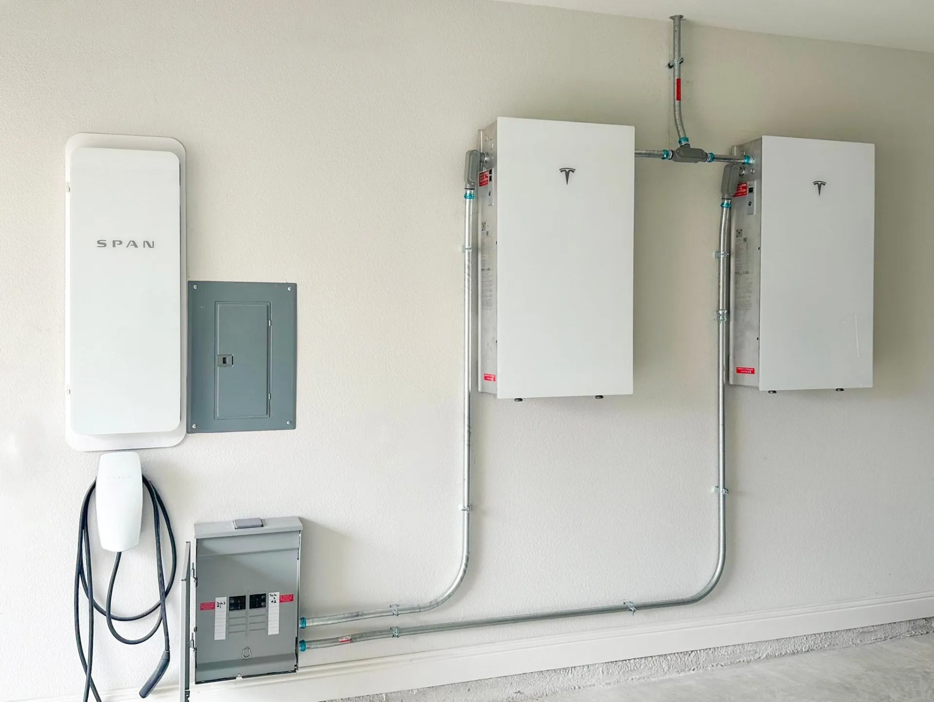 SPAN Drive EV charger installed in a Texas garage with a SPAN Smart Electrical Panel