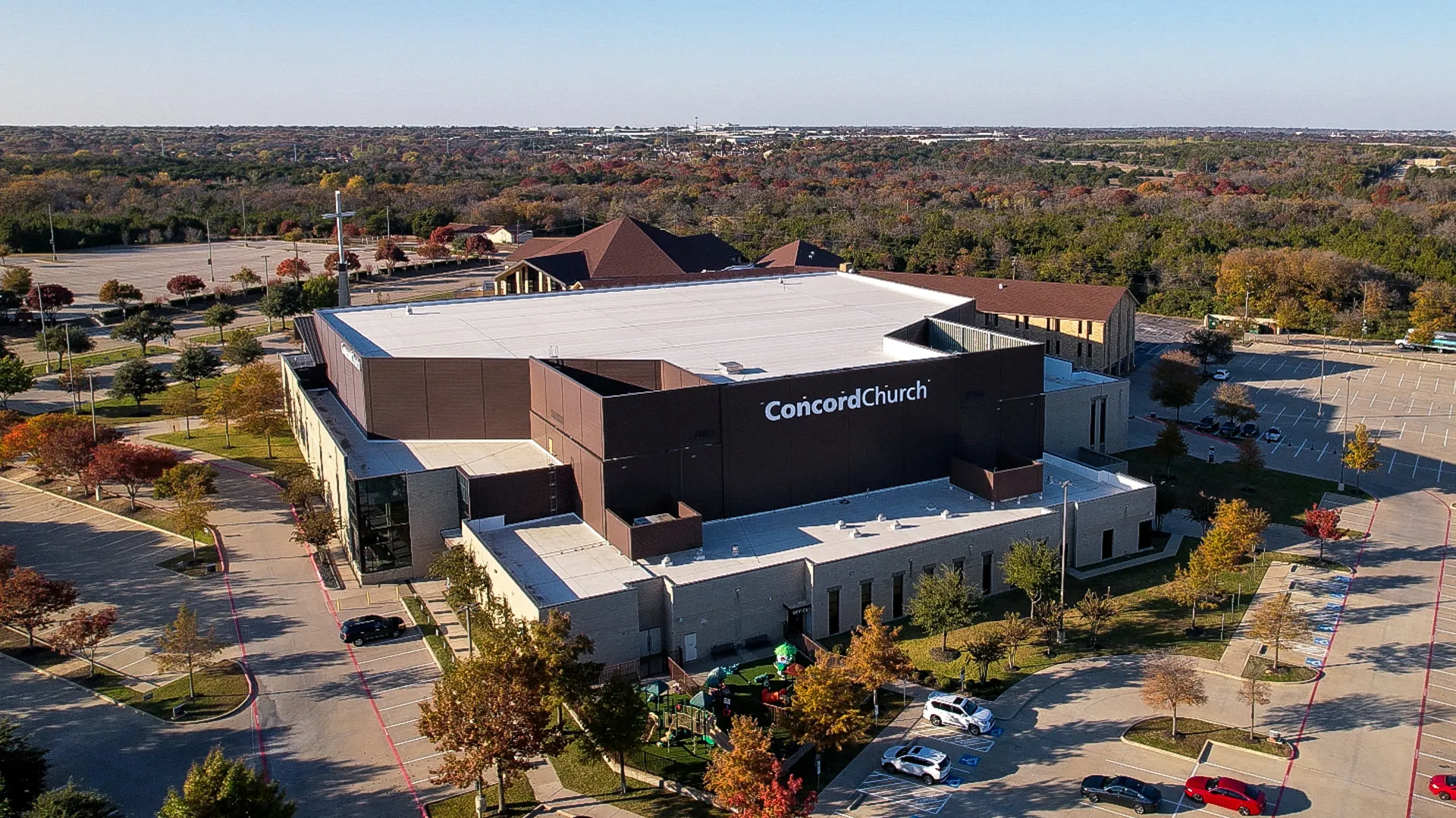 Aerial view of Concord Church commercial TPO roof installation by Good Faith Energy in Texas