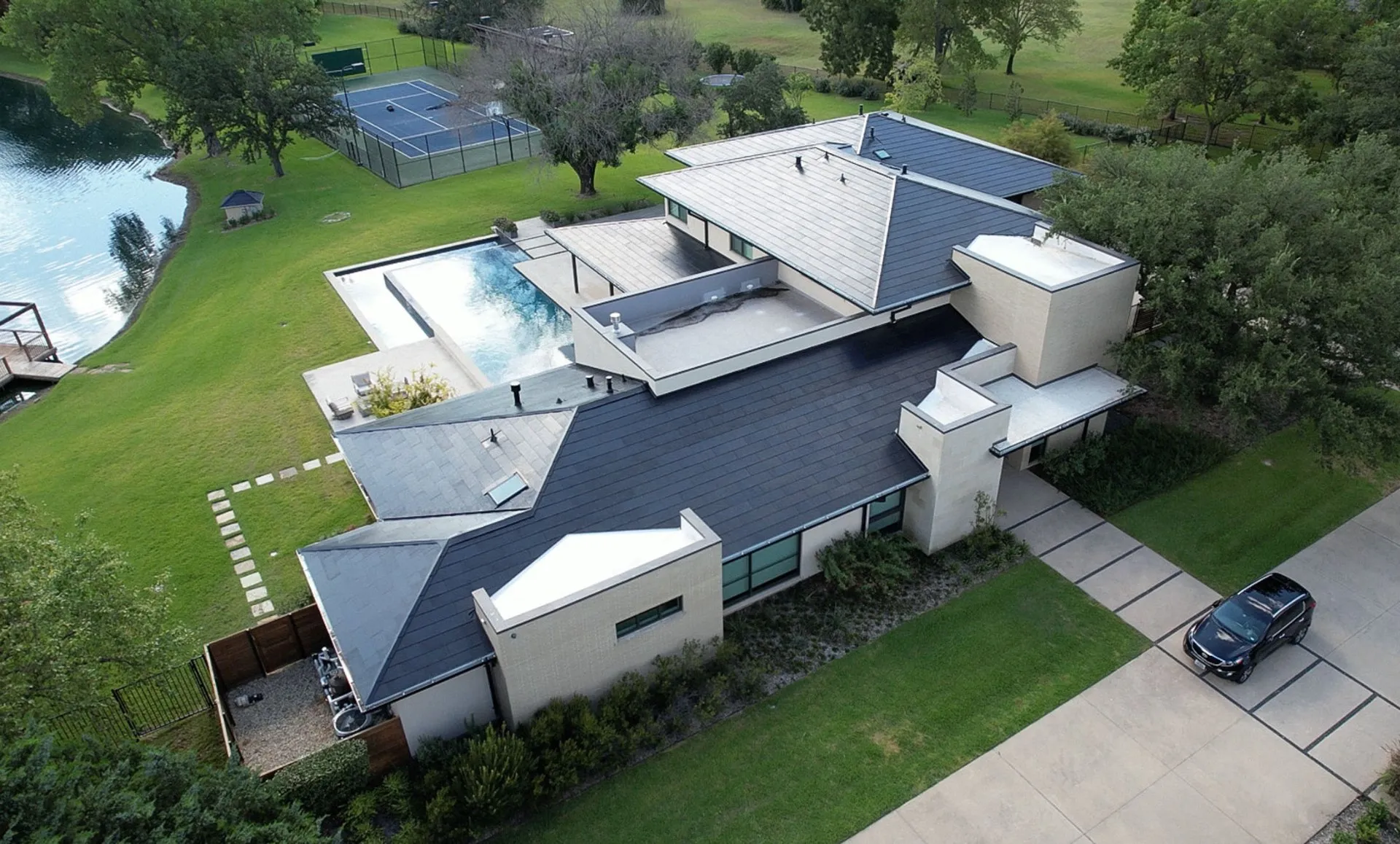 Tesla Solar Roof on a modern lakeside home in Texas