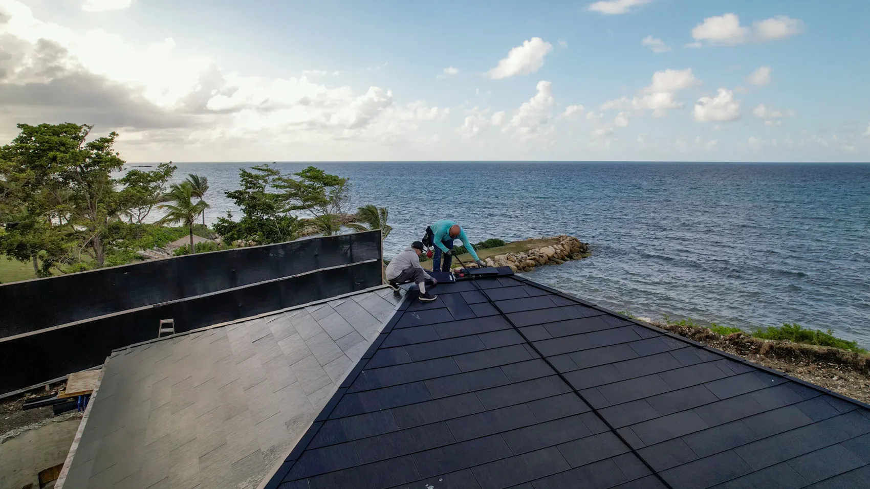 Good Faith Roofing crew installing Tesla Solar Roof tiles