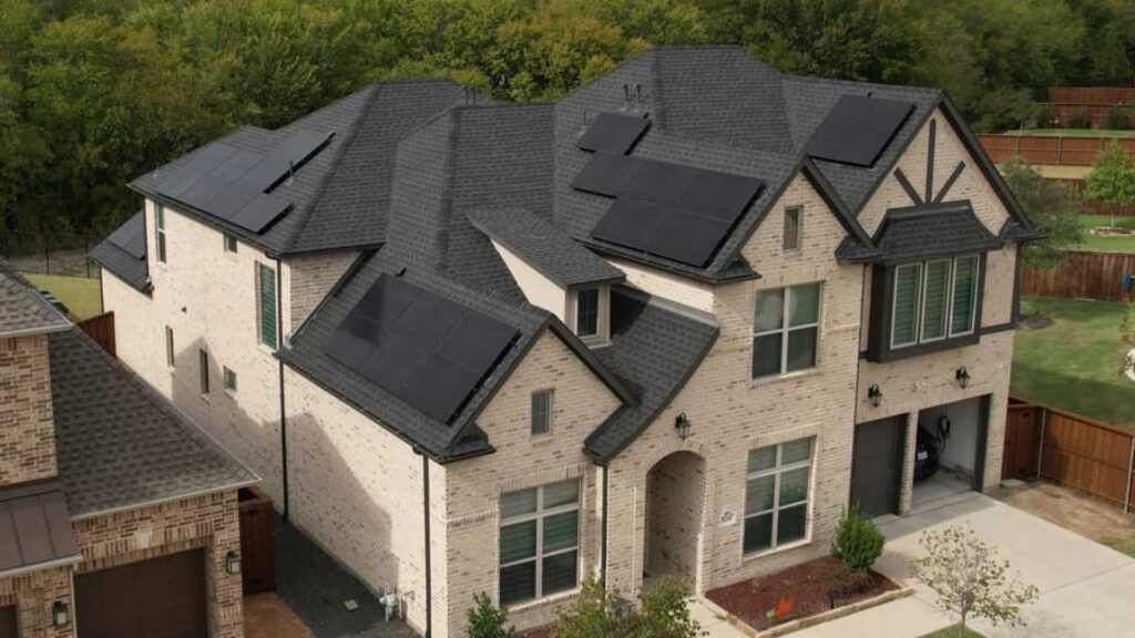 huge house with gray roof and solar panels installed